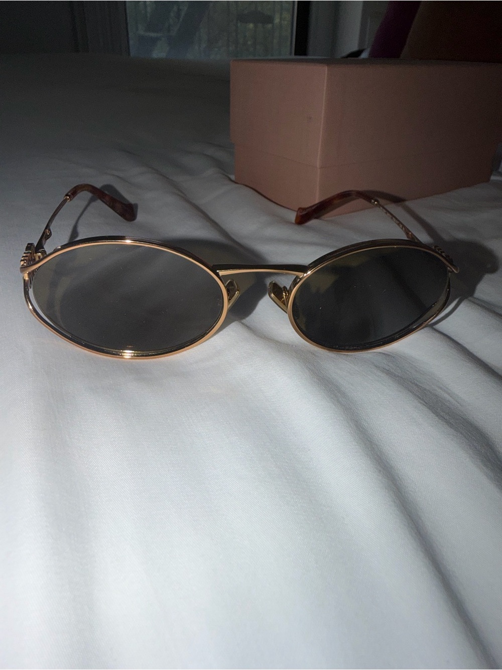 Miu Miu Oval Sunglasses